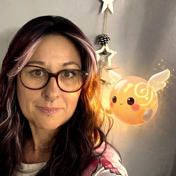Barbara, the creator of Little Spark Stories, with Spark glowing softly beside her